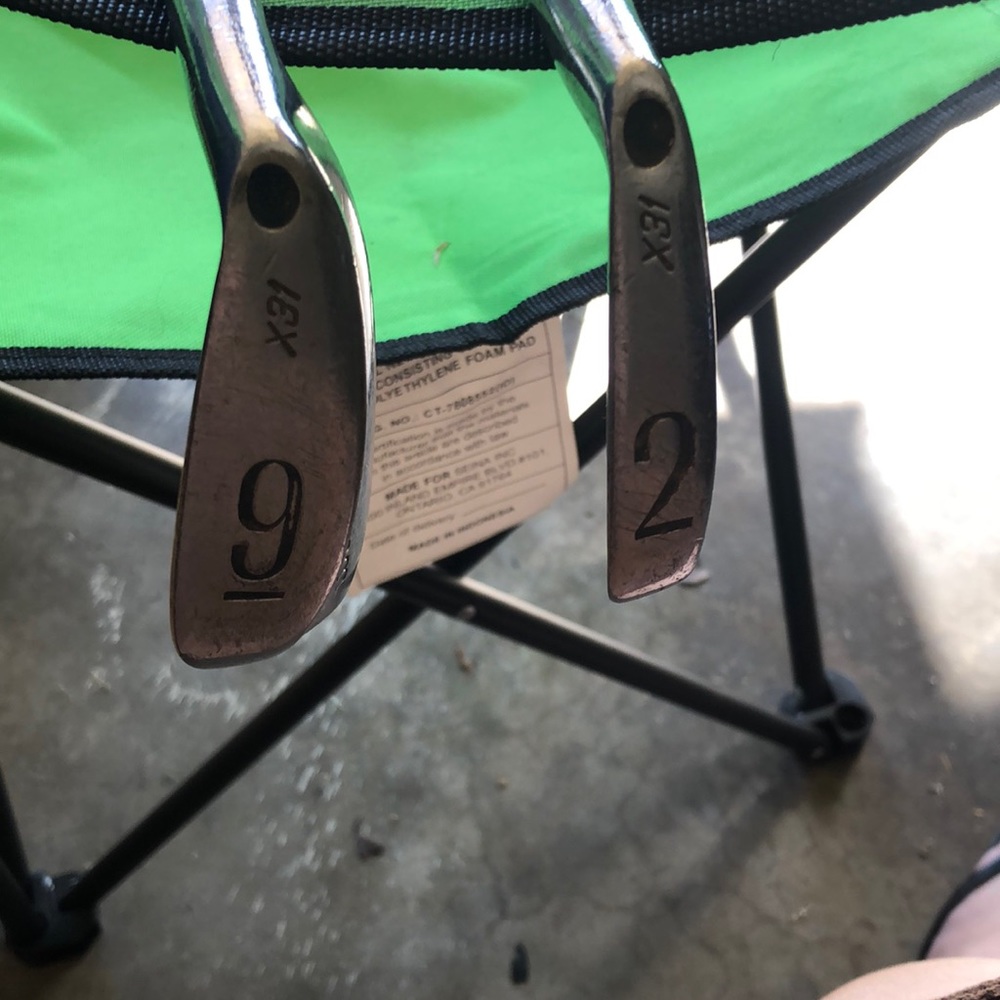 Two pro guard Wilson number nine and number two golf clubs